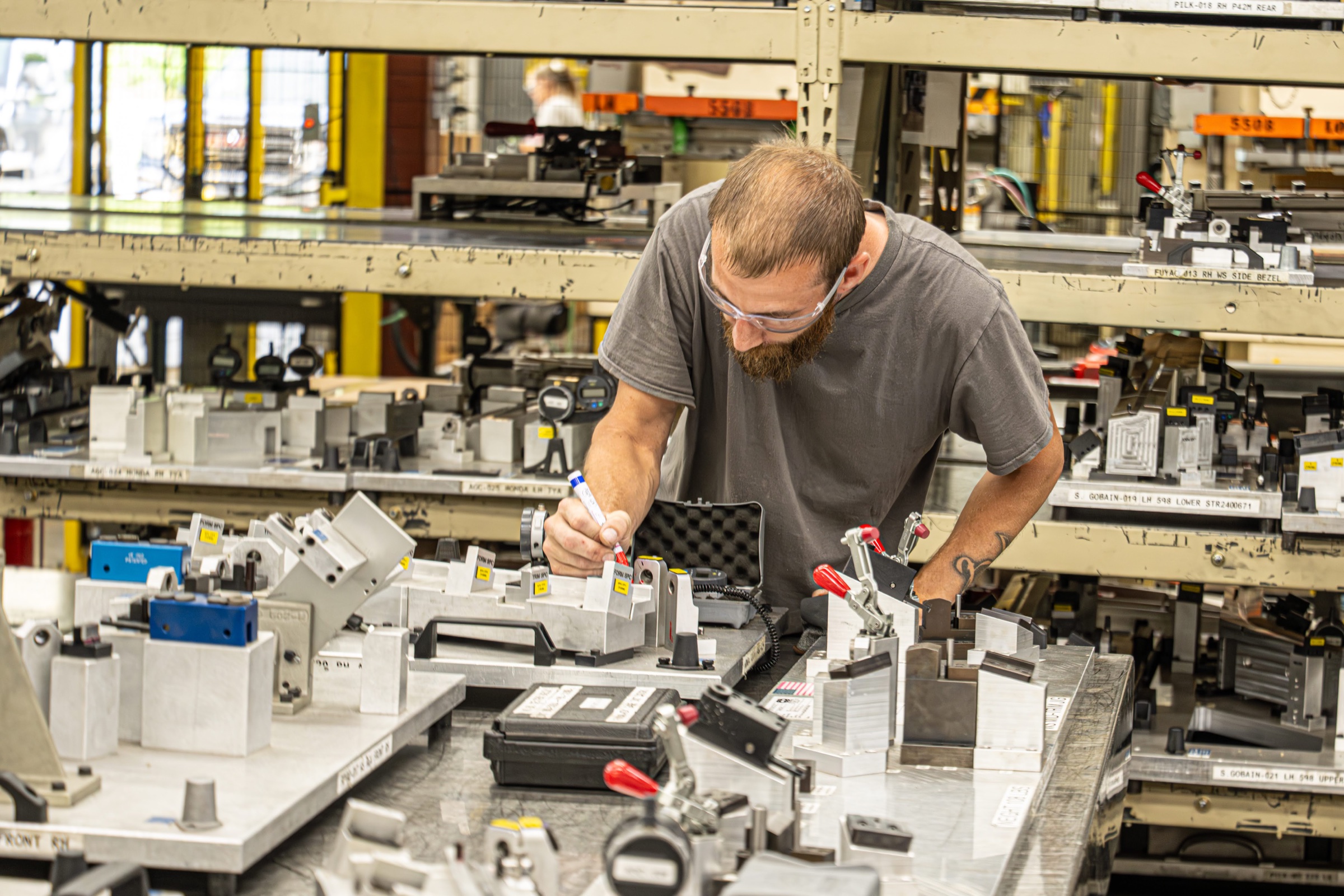 Big Rapids Products team member inspecting production tooling